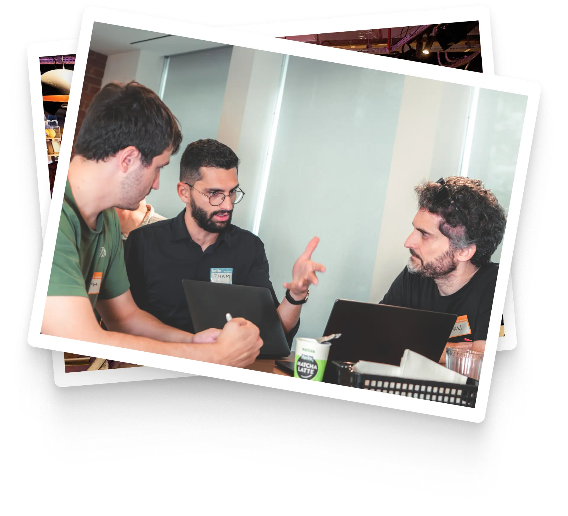 Industry professionals collaborating around laptops at a Lovable workshop